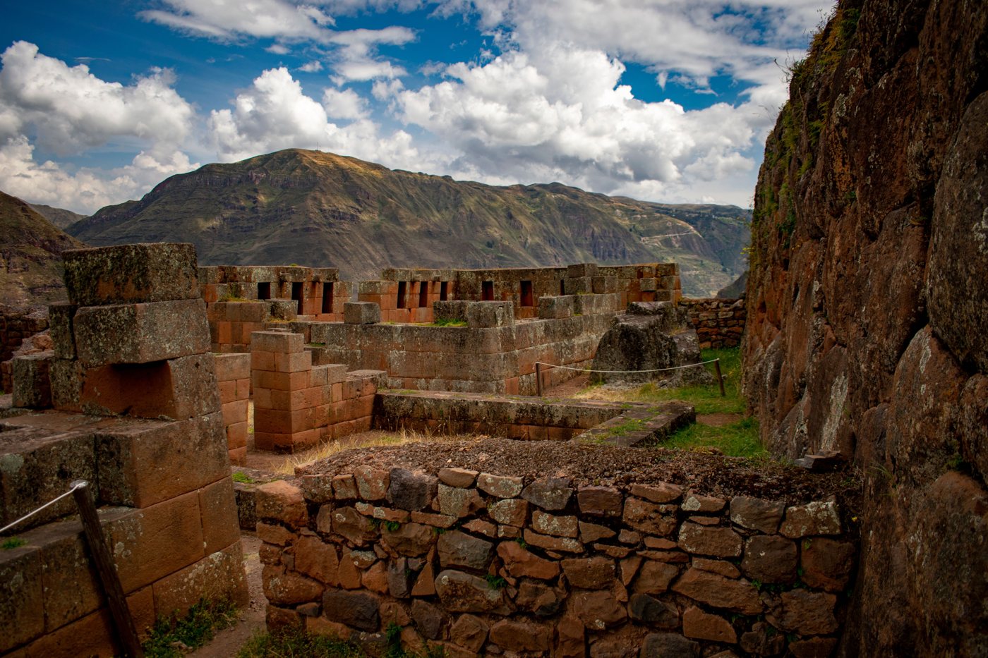 Inca stone walls of Pisac with the mountains of the Sacred Valley beyond
