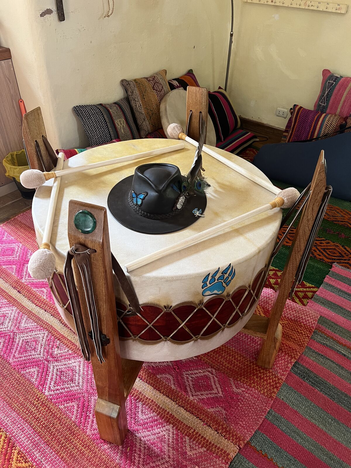 A ceremonial drum rests on its stand in the shala