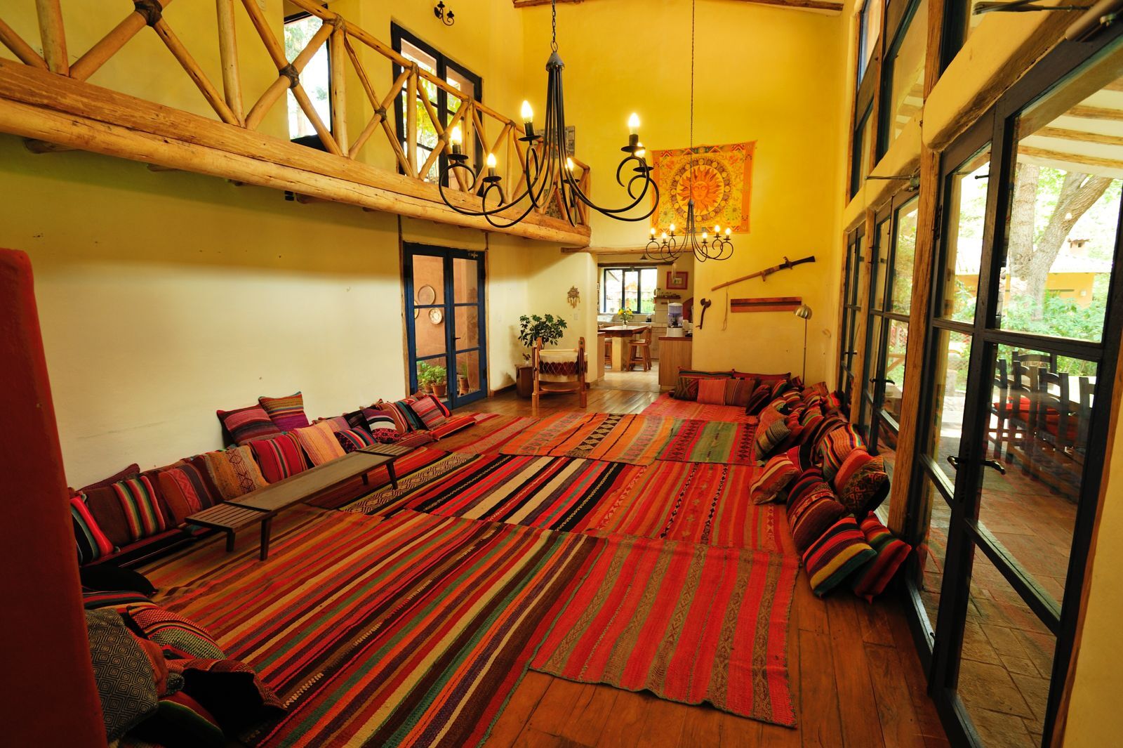 The shala filled with sunlight and colourful Andean rugs